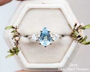 Aquamarine pear moissanite and 14k gold twig engagement ring