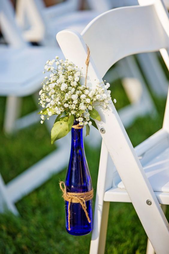 baby’s breath in blue glass beer bottle