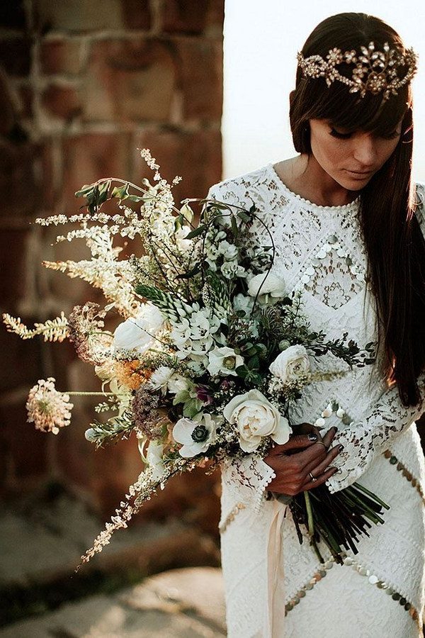 lush bouquet of wildflowers, garden roses, anemones, hellebore and bishops flower