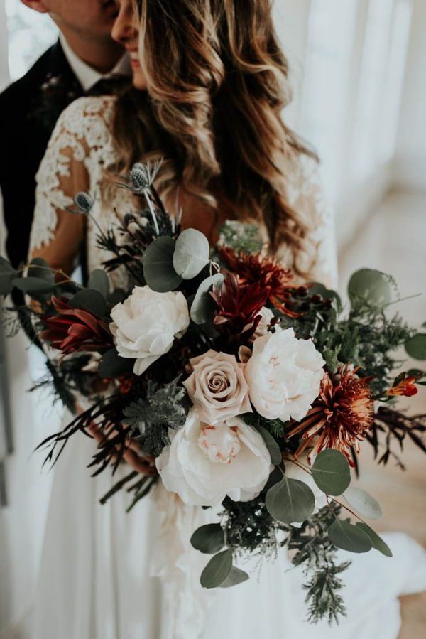 white roses and greenery eucalyptus wedding bouquet