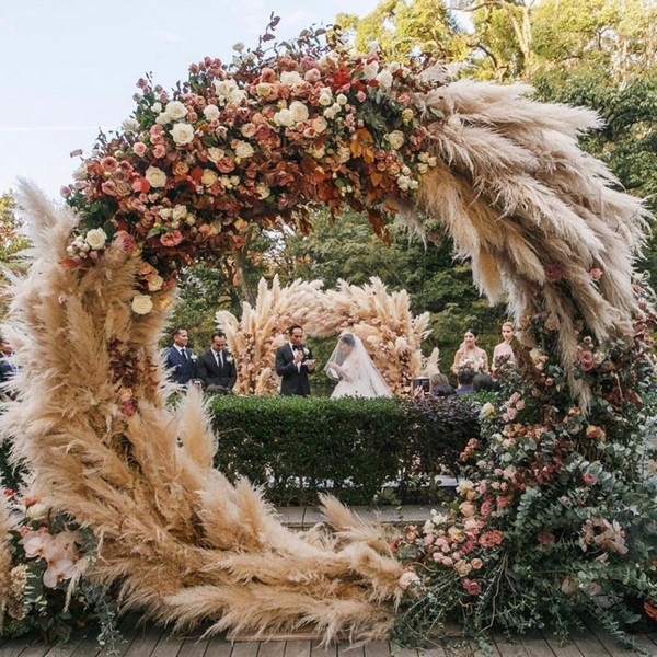 mixed roses and pampas grass circle wedding backdrop