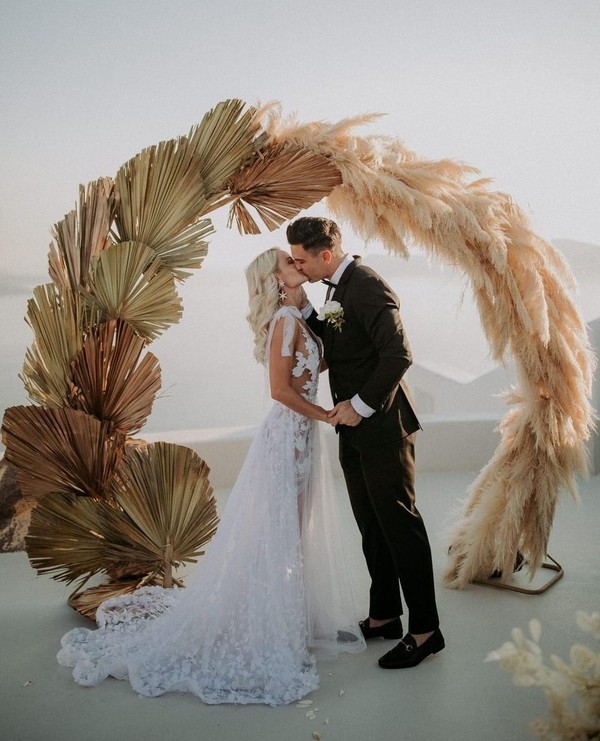 mixture of dried botanicals and pampas grass wedding backdrop